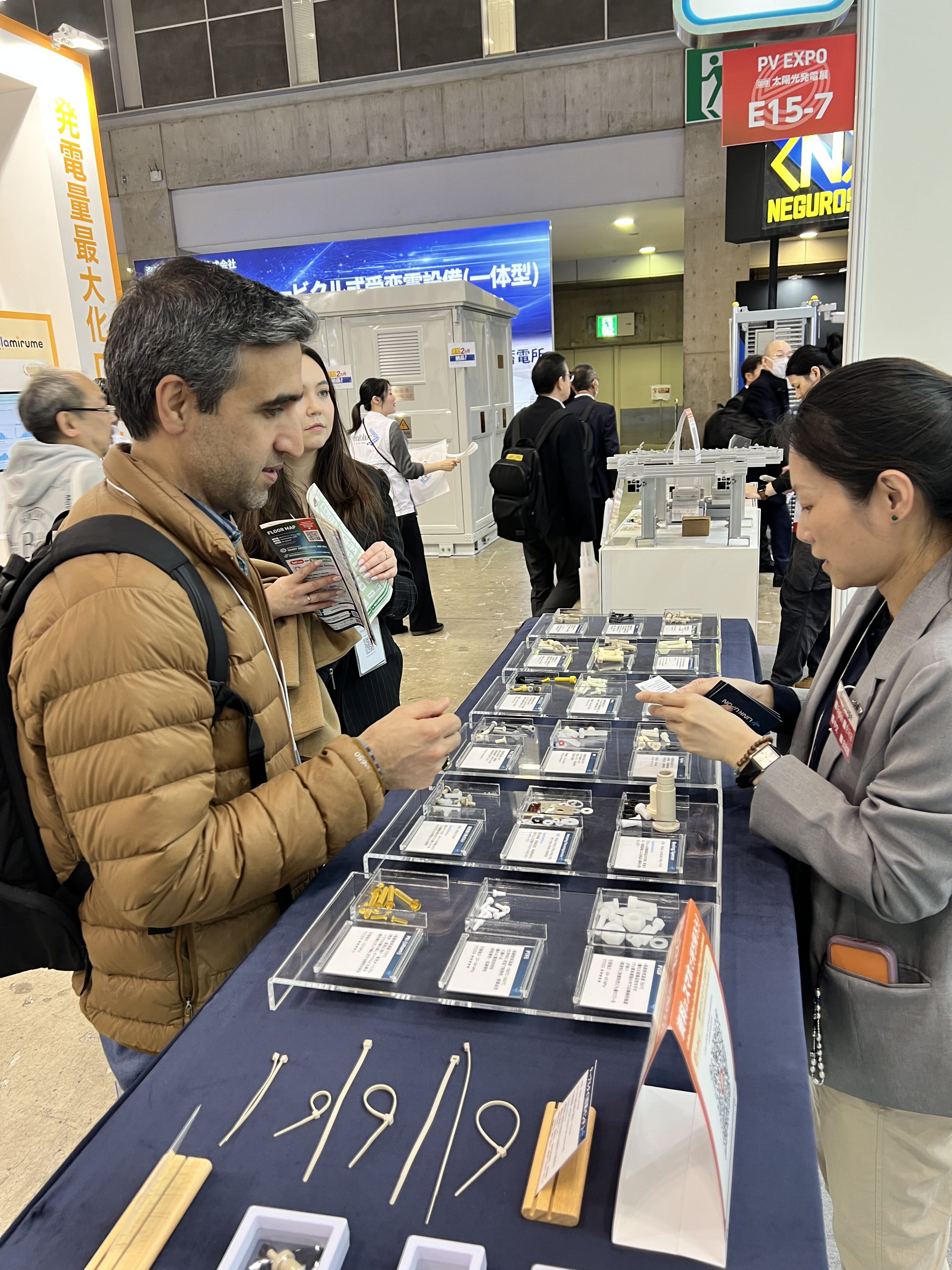 Visitors exploring plastic components